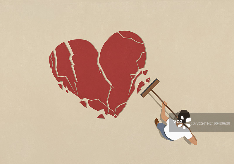 拿着扫帚的男人在清理破碎的心。图片素材