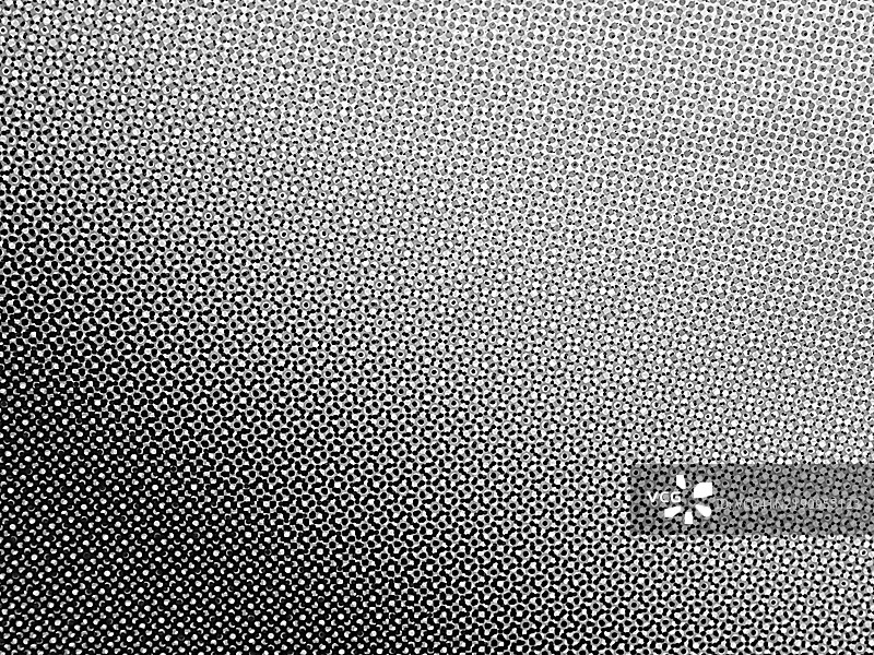 浅灰色背景上的灰色和黑色圆点。偏移印刷海报的微距摄影。图片素材