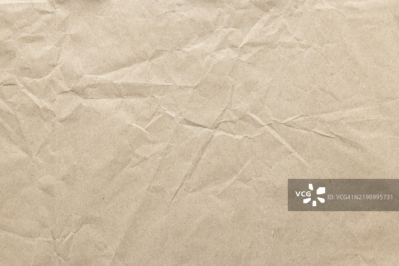 皱褶的棕色纸张纹理背景图片素材