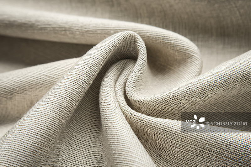 一种浅色织物，带有细腻的编织图案图片素材