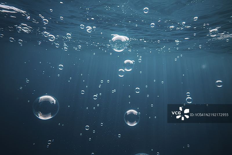一幅宁静舒缓的图像，深蓝色背景上散布着许多不同大小的气泡。图片素材