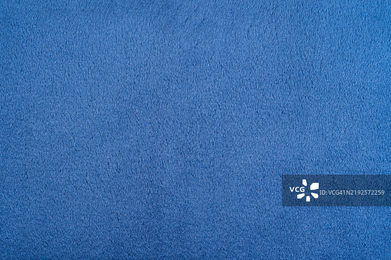 海军蓝天鹅绒质感背景。图片素材