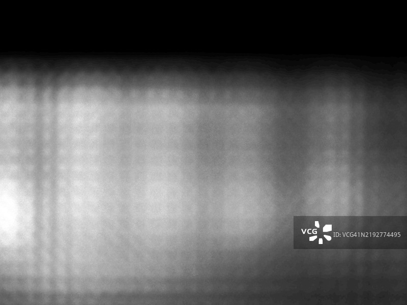 背光电视屏幕的微距摄影，呈现灰色和黑色的色调。图片素材