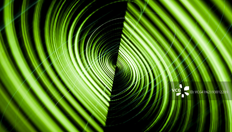 绿色旋转漩涡创造出迷人的视觉效果图片素材