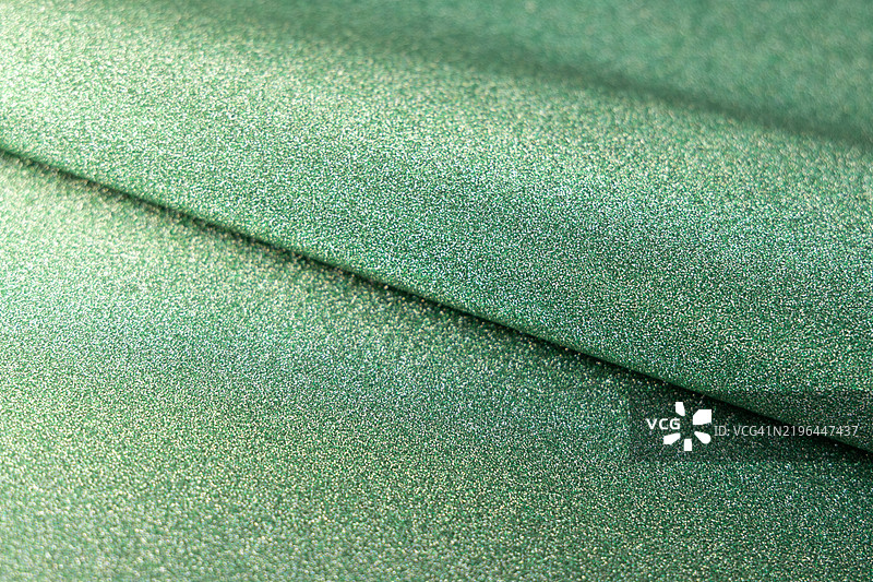 绿色闪亮的亮片纸纹理，闪耀的奢华面料图片素材
