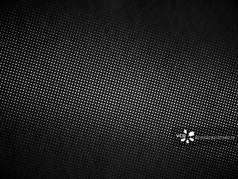 黑色背景上的白色圆点（中心大，向外逐渐变小）图片素材