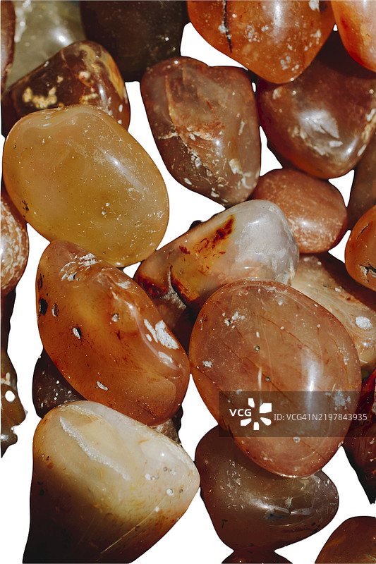 五彩斑斓的半宝石。不同形状的卵石。半宝石收藏。各种颜色的不同种类石头。不同类型石头的纹理。宝石。图片素材