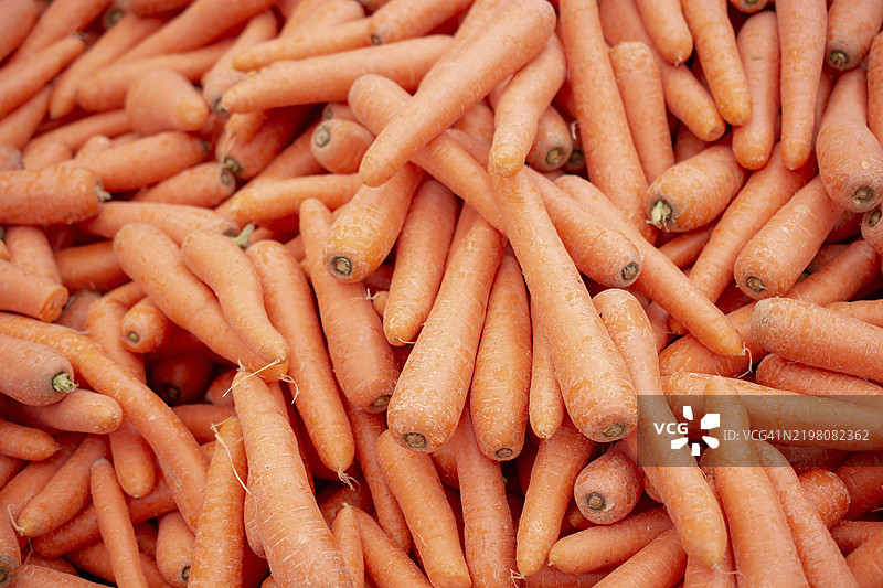 新鲜大橙色胡萝卜的纹理背景图片素材