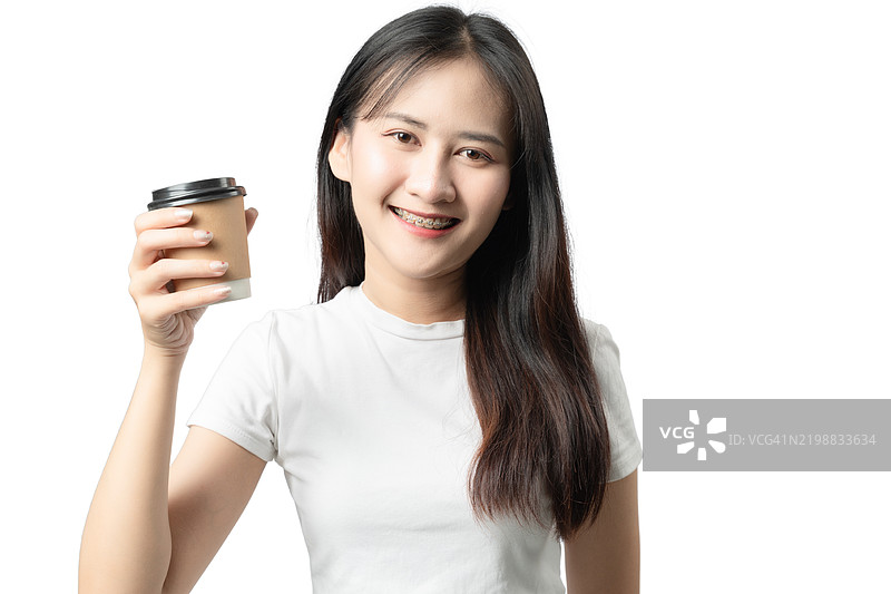 一位女性正在拿着咖啡杯图片素材