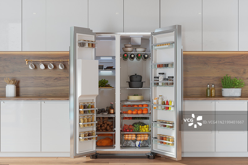 现代厨房内部，正面视角的开放冰箱，里面装满了水果、蔬菜和各种食物图片素材