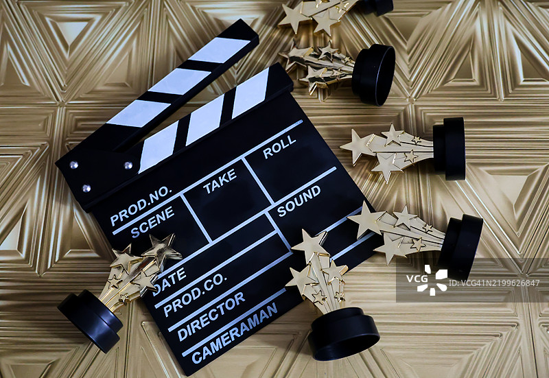 电影拍摄板和金星奖奖杯图片素材