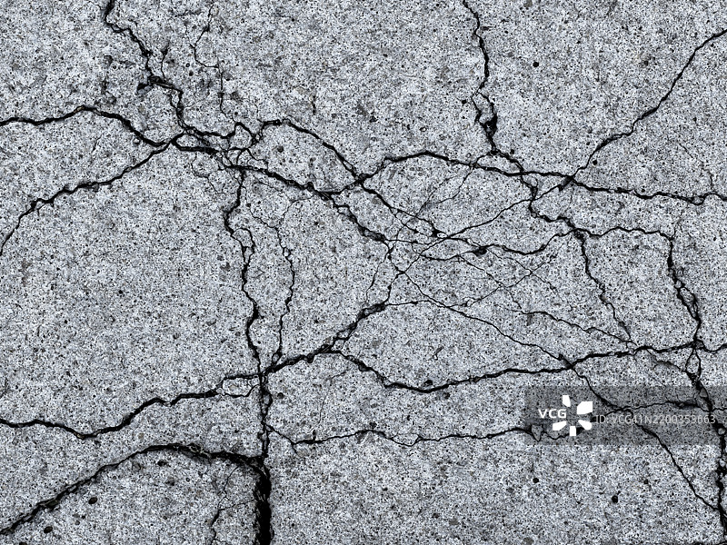 混凝土地面上的裂缝。图片素材