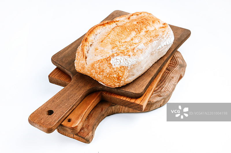 面包在白色背景下的烘焙店展示图片素材