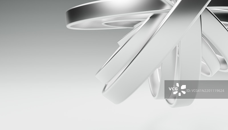 白色背景下相互交错的金属环的抽象3D渲染图图片素材