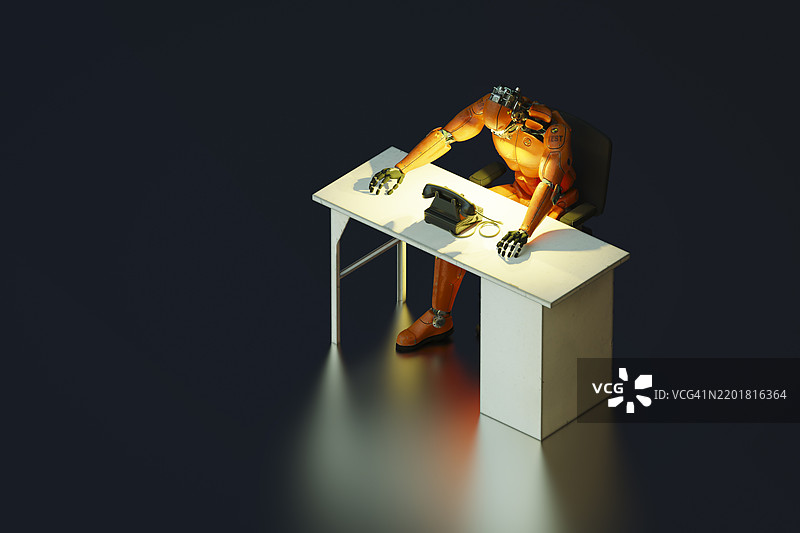 机器人在桌子旁等待电话来电图片素材