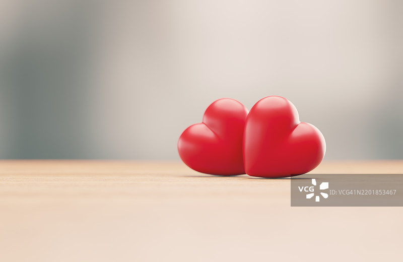 模糊背景前的红色心形 - 爱的概念图片素材