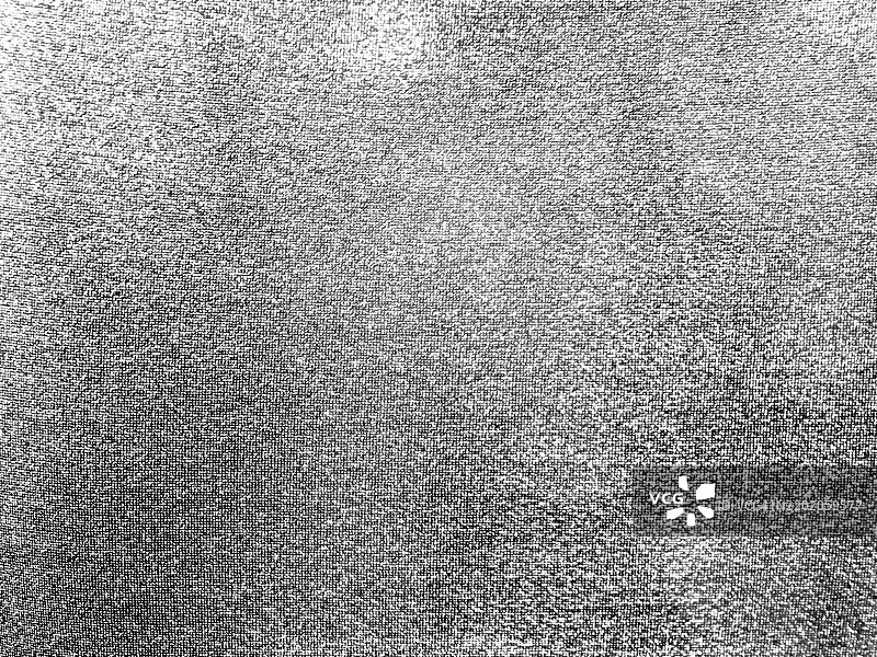 白色和灰色斑点布料的特写。阳光。黑白。比利时布鲁塞尔。图片素材