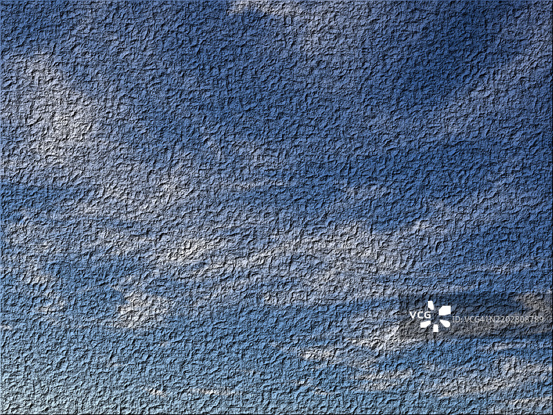 抽象背景。用蓝色和白色塑料漆涂刷的墙壁不规则纹理。图片素材