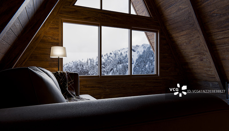 温馨的小屋内部，透过三角形窗户可以看到雪山美景图片素材