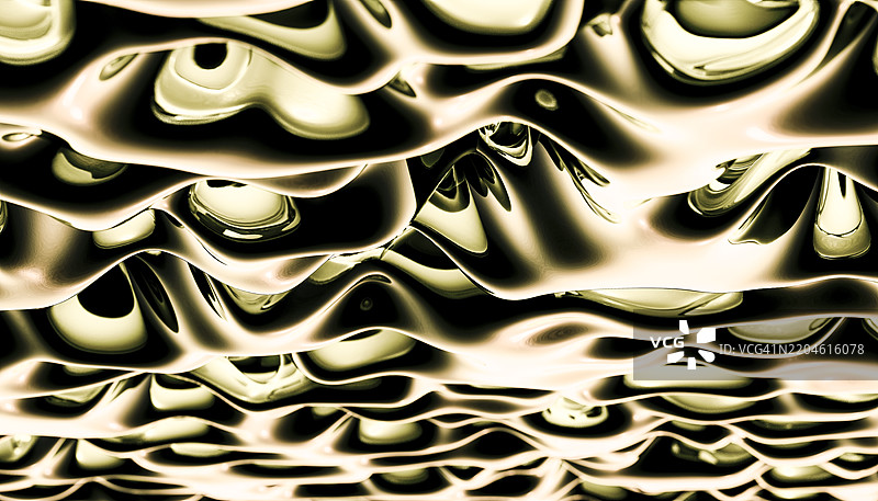 金色金属液体表面形成抽象波浪图片素材