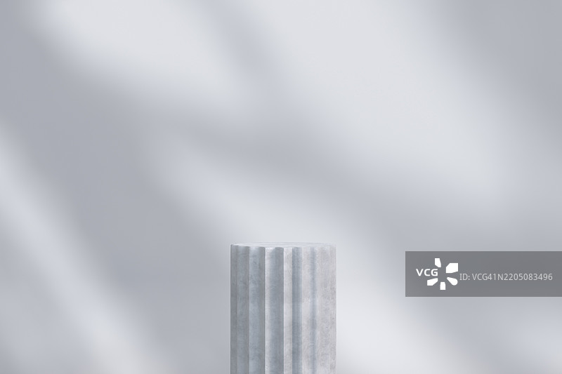 简约的静物作品，混凝土基座在柔和光影下图片素材