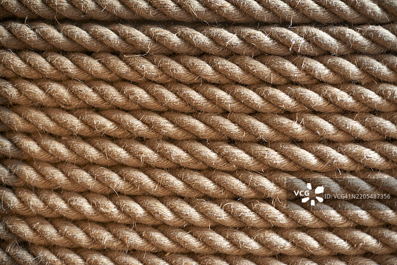 紧密缠绕的麻绳形成了一个有纹理的背景图片素材
