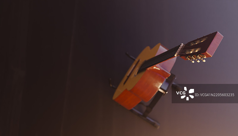 古典吉他静静地放在支架上，随时准备演奏图片素材