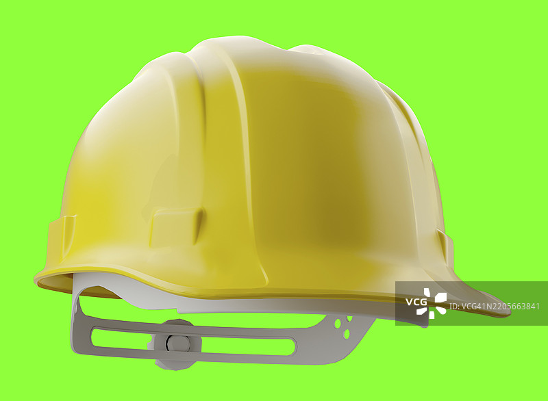 黄色建筑安全帽在绿色背景上独立展示图片素材