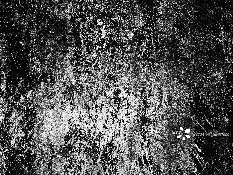 白色、灰色和黑色涂漆并呈现出古铜色的混凝土墙特写。粗糙的纹理。法国巴黎。图片素材