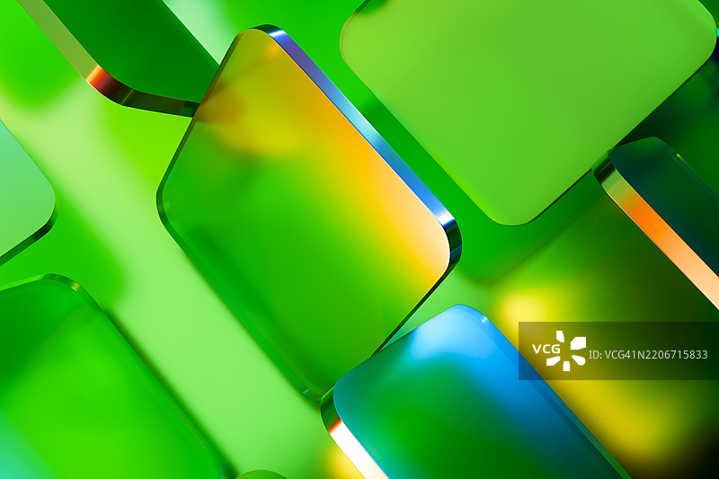 未来主义抽象背景，充满生机的绿色、蓝色和黄色渐变的玻璃状几何形状。现代高科技美学，完美适用于创新、科技和数字设计概念。图片素材
