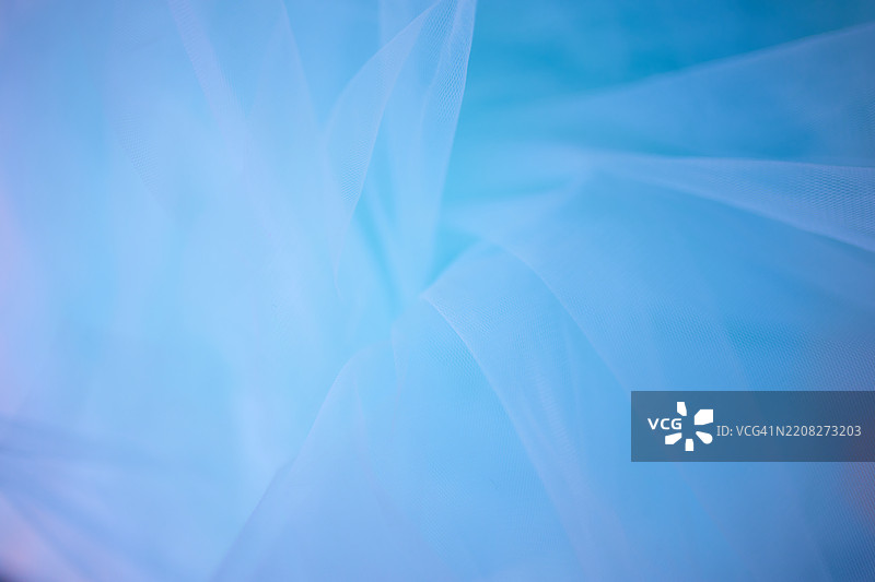 淡蓝色抽象纹理，带有细微的布料褶皱和光滑的图案图片素材