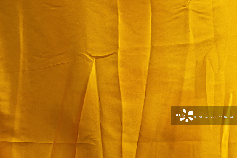 黄色自然生动的亚麻纺织品，作为背景的抽象图案。图片素材