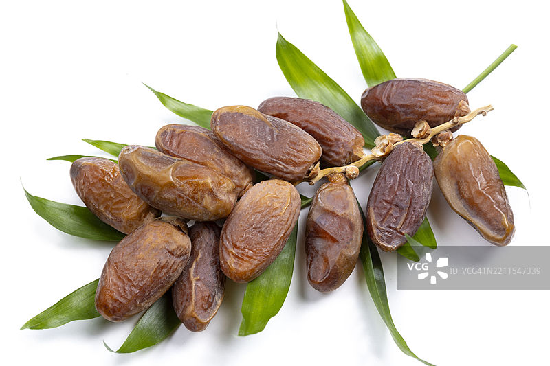 棕榈叶上的枣子图片素材