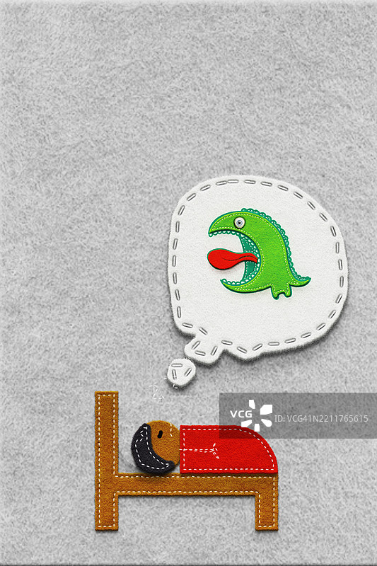 睡觉的男孩梦见怪物。噩梦。图片素材