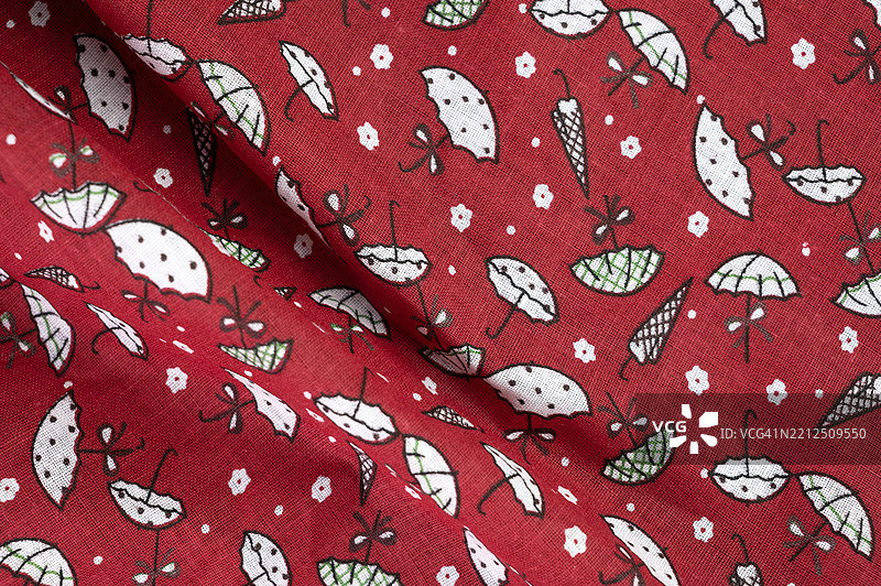 红色背景的小伞图案面料图片素材