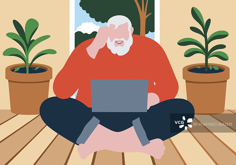 一位留着胡子的男子盘腿坐在室内，笔记本电脑放在盆栽植物之间。图片素材