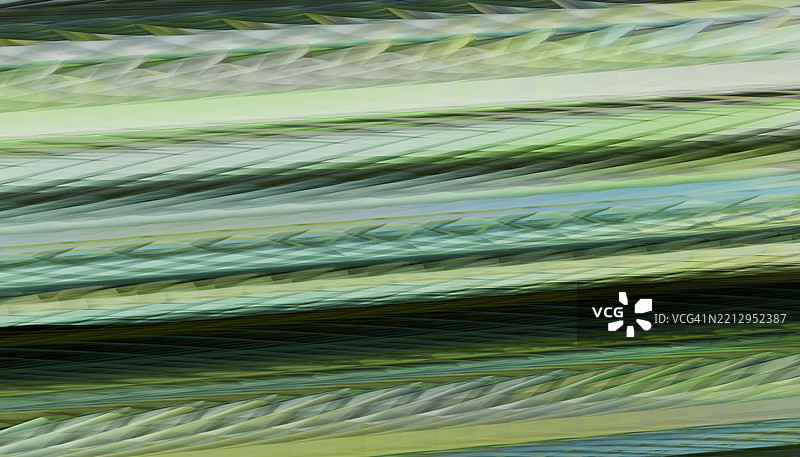 抽象的绿色和蓝色线条形成动态图案图片素材