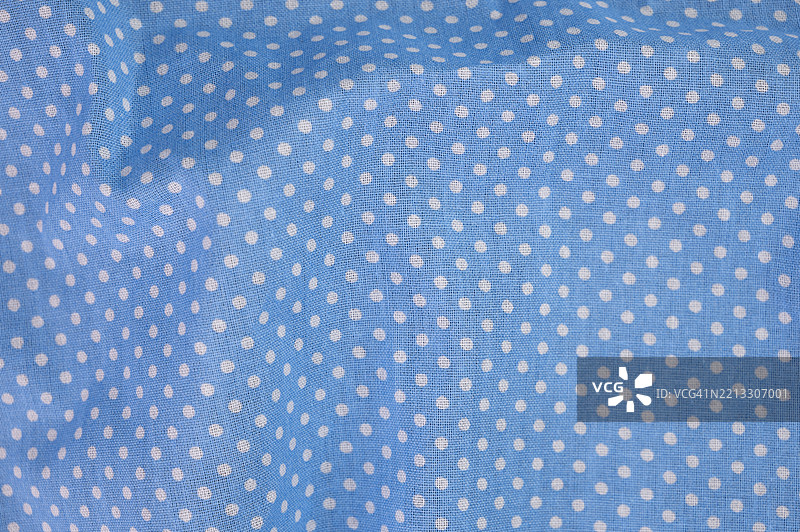 蓝色背景上带有小白点的图案面料图片素材