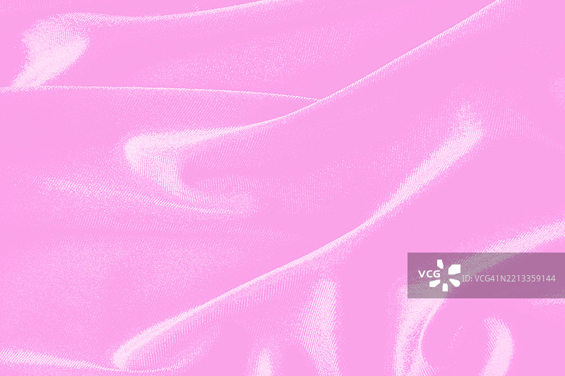 粉色和洋红色的柔和天鹅绒丝绸面料，带有褶皱。图片素材