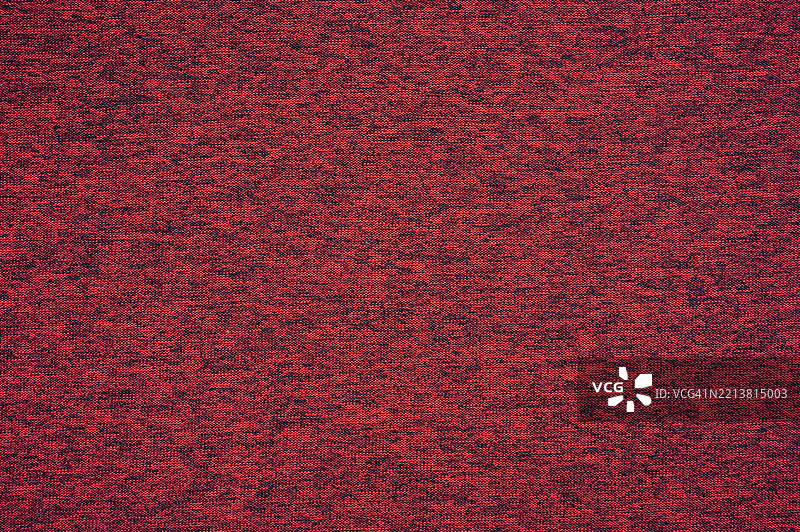 红色再生聚酯布料的全景纹理和背景。图片素材