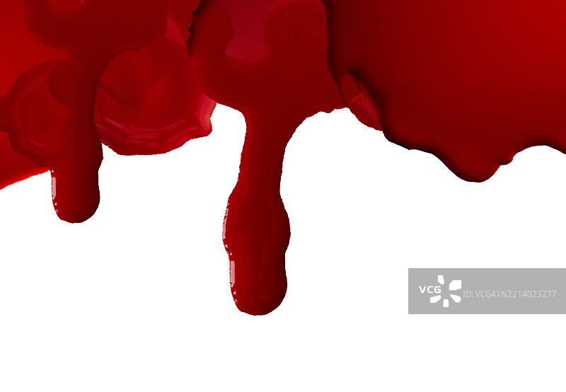 浓厚的血迹在白色表面上移动。图片素材