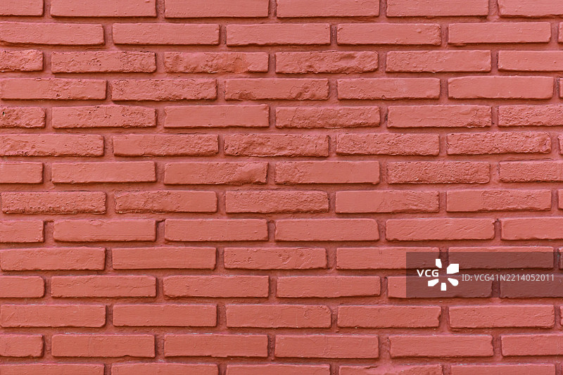 红色与旧的磨损混凝土墙面纹理作为背景。图片素材