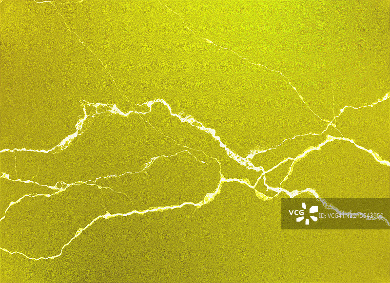 带有裂纹的黄色调光滑金属表面。图片素材