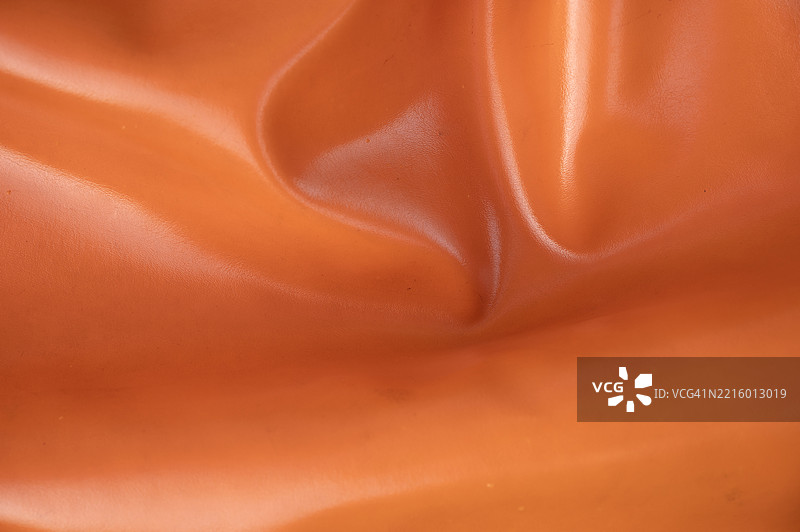 高分辨率的橙色皮革背景纹理全景拍摄图片素材