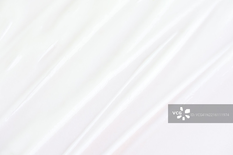 白色调的奶油质感表面特写，突出光滑和光泽的外观图片素材