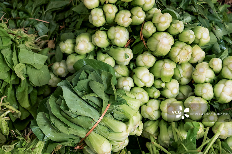 北越少数民族市场出售的叶菜类蔬菜图片素材