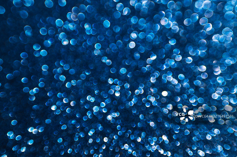 蓝色闪闪发光的亮片虚化灯光背景图片素材
