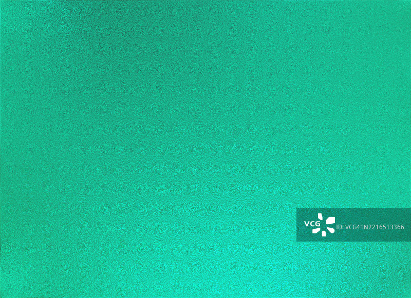 明亮柔和的绿色金属光泽背景，带有细腻粗糙的纹理。图片素材