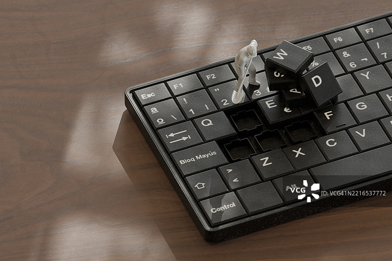 微型3D人物在办公室环境中使用键盘工作图片素材