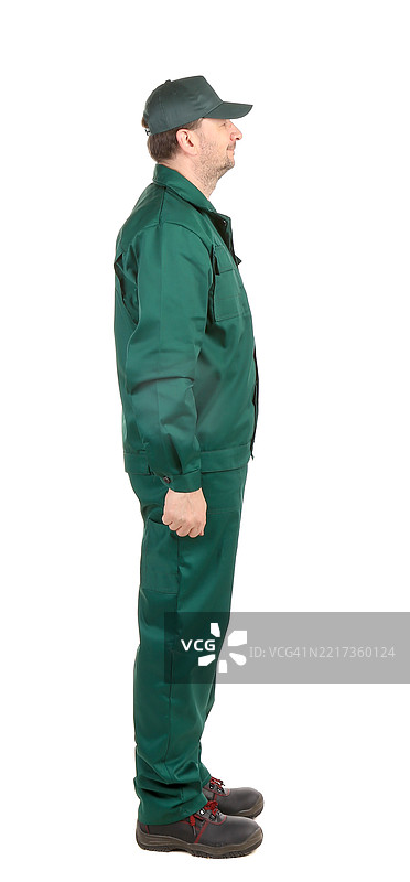 工人在白色背景前侧身站立图片素材